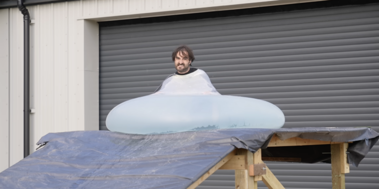 Man rolls downhill in giant water balloon in glorious slow motion