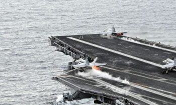 Iran claims missile attack on US aircraft carrier, destroyer